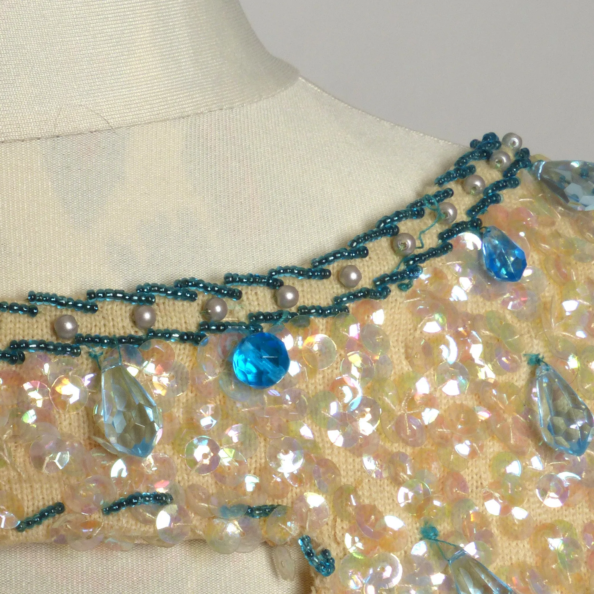 Circa 1960s Hong-Kong Wool Sequin and Beaded Cream and Blue Shell Sweater