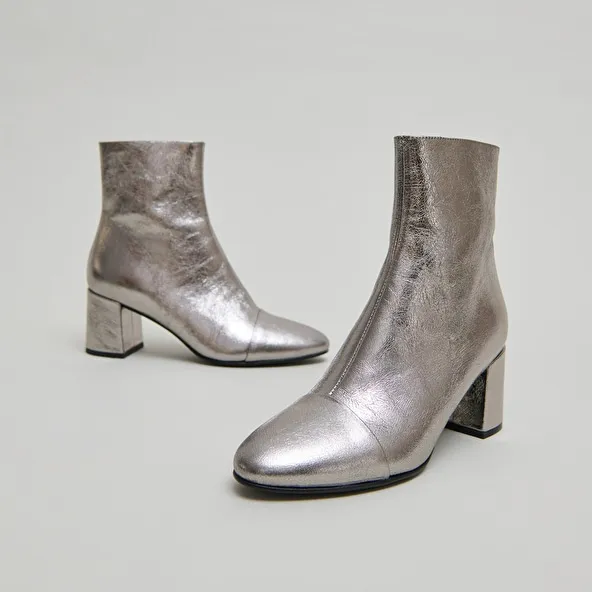 Heeled ankle boots in dark metallic leather