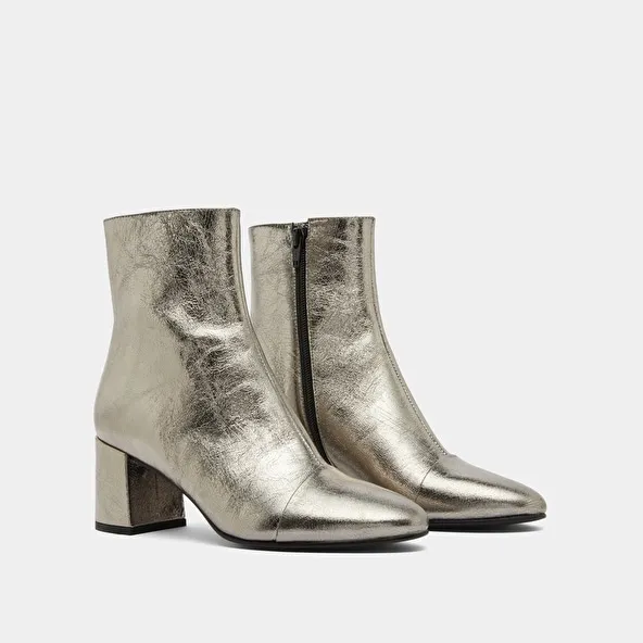 Heeled ankle boots in dark metallic leather