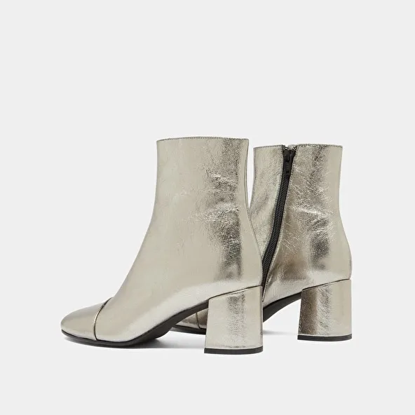 Heeled ankle boots in dark metallic leather